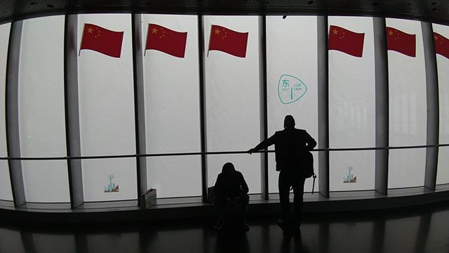 The view at the top of Shanghai Tower on a cloudy afternoon.